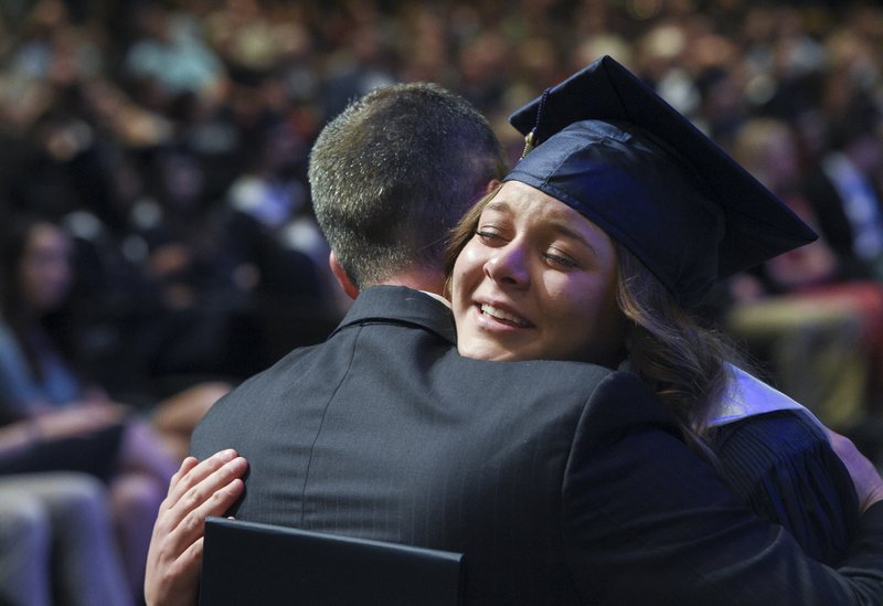 Leadership team member Jeff Conaway hugs graduate Katelyn Franzke during a graduation ceremony, Thursday, May 17, 2019 at the Cross Church Springdale campus in Springdale.

Shiloh Christian School honored their 37th graduating class in a ceremony. 87 students walked across the stage to receive their high school diplomas.