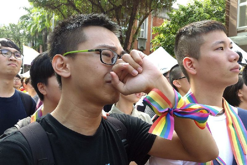 Supporters celebrate Friday’s vote by lawmakers in Taipei, Tai- wan, that legalized same-sex marriage, a first for Asia. 