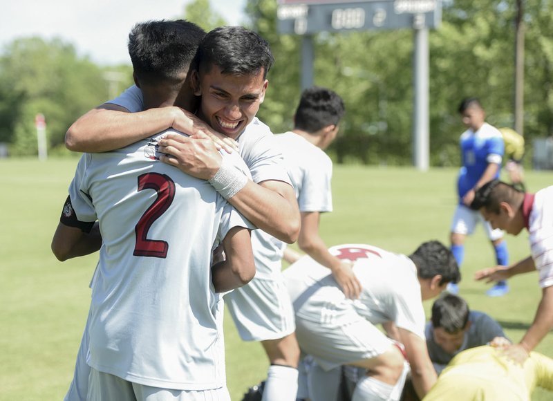 NWA Democrat-Gazette/CHARLIE KAIJO Springdale High School players react after winning the Class 6A State Soccer Tournament championship, Friday, May 18, 2019 at Razorback Field in Fayetteville. Springdale High School defeated Bryant High School 3-0