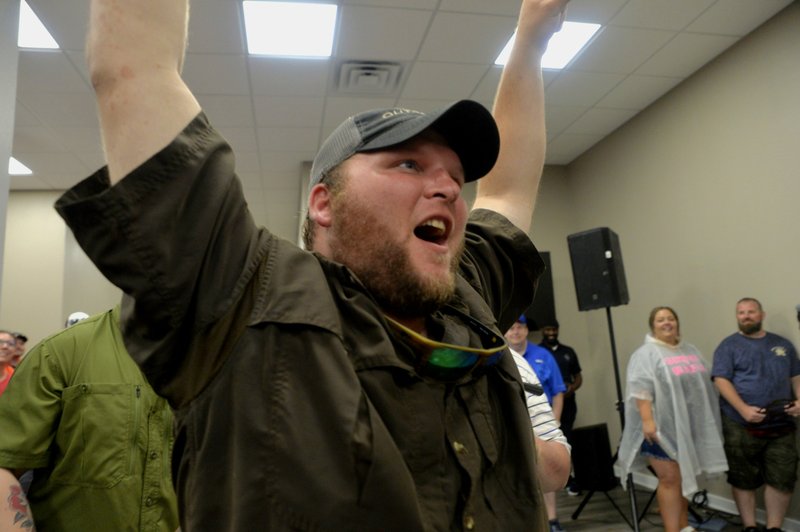 Hunter Caldwell, a team member of Delta Waterfowl, celebrates after the Magnolia-based team's winning number was called at Saturday's 2019 World Championship Steak Cook-Off. Not pictured are head cook Zac Brasher and team member Cody Caldwell.