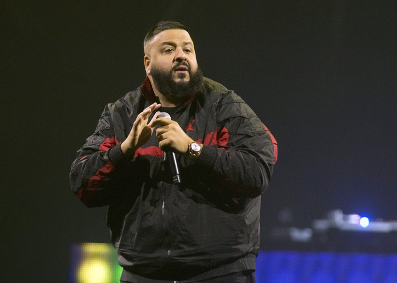 FILE - In this March 23, 2018 file photo, DJ Khaled performs as the opening act for Demi Lovato during her &quot;Tell Me You Love Me World Tour&quot; in Philadelphia. Khaled is releasing a single with Nipsey Hussle that was filmed days before Hussle was shot to death in Los Angeles. Khaled announced on Twitter on Wednesday, May 15, 2019, that all proceeds from &#x201c;Higher&#x201d; will be donated to Hussle&#x2019;s children, 10-year-old Emani and 2-year-old Kross. (Photo by Owen Sweeney/Invision/AP, File)