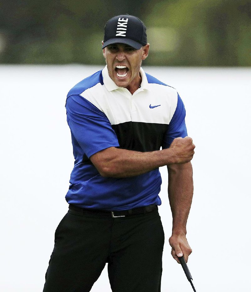 Brooks Koepka reacts after sinking a par putt on the 18th green to win the PGA Championship on Sunday at Bethpage Black in Farmingdale, N.Y. He closed with a 4-over 74 for a two-shot victory over Dustin Johnson.