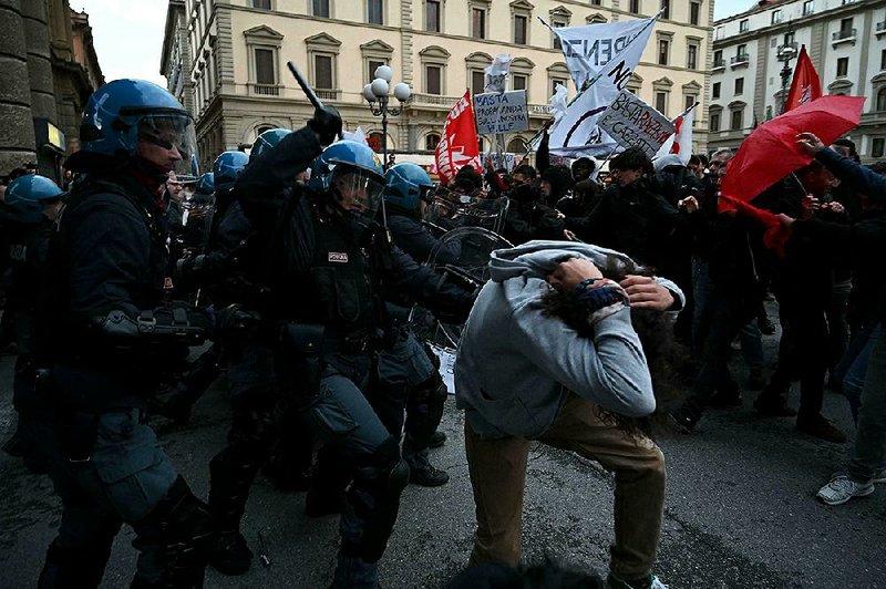 Police and protesters clash Sunday during a demonstration against right-wing Interior Minister Matteo Salvini in Florence, Italy. The protest occurred as Salvini was drumming up support for the right-wing candidate for mayor, Ubaldo Bocci. 