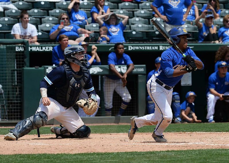 Shortstop Deshaun Cordova (right) hit an RBI single in the 10th inning Monday, scoring John Henry Maloch from second base, to give North Little Rock a 5-4 victory over Springdale Har-Ber for its third state title despite finishing with a 15-18 record.