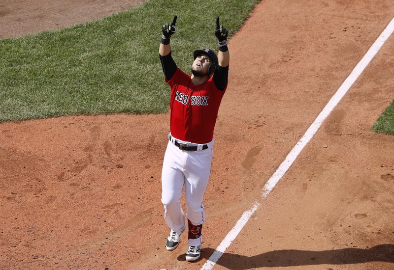 Boston Red Sox's Michael Chavis points skyward before crossing home plate after his home run against the Houston Astros during the fifth inning of a baseball game Sunday, May 19, 2019, at Fenway Park in Boston. (AP Photo/Winslow Townson)
