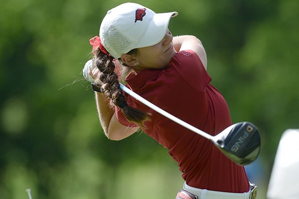Kaylee Benton of Arkansas watches her tee shot Tuesday, May 21, 2019, on the 15th tee box during her match with Jennifer Kupcho of Wake Forest in the Women's NCAA Golf Championship at Blessings Golf Club in Fayetteville.