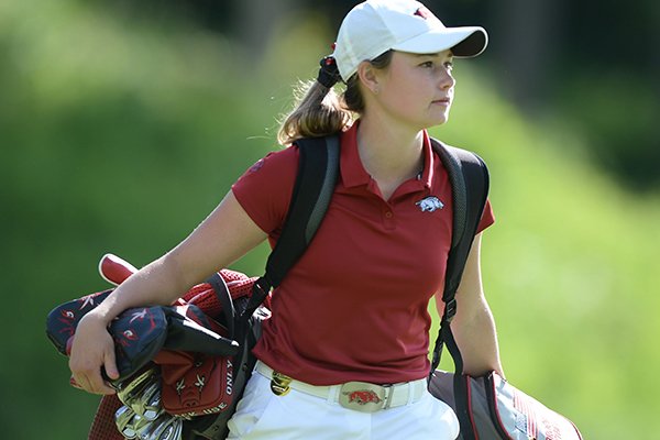 Arkansas freshman golfer Brooke Matthews carries her bag during the NCAA Women's Golf Championships on Tuesday, May 21, 2019, in Fayetteville.