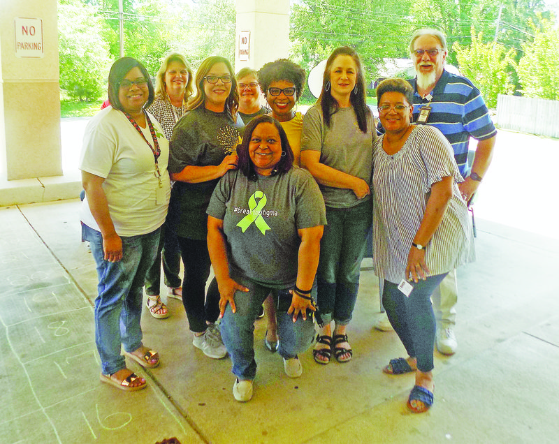 Awareness: South Arkansas Regional Health Center staff poses with El Dorado Mayor Veronica Smith-Creer during the event. Smith-Creer declared the month of May to be Mental Health Awareness Month in El Dorado during the event. 