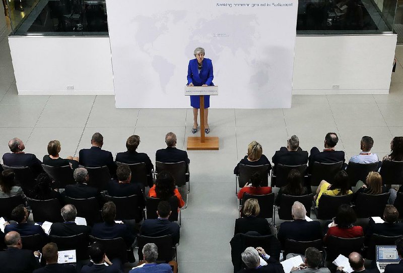 Britain’s Prime Minister Theresa May delivers a speech in London  on Tuesday. The British government is discussing how to tweak  its proposed European Union divorce terms in a last-ditch attempt  to get Parliament’s backing for May’s deal with the bloc. 