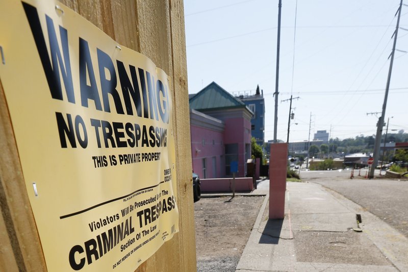 A &quot;No Trespassing&quot; sign is posted along the fencing protecting the parking lot of the Jackson Women's Health Organization, Friday, May 17, 2019, in Jackson, Miss. The facility is the state's only abortion clinic. (AP Photo/Rogelio V. Solis)