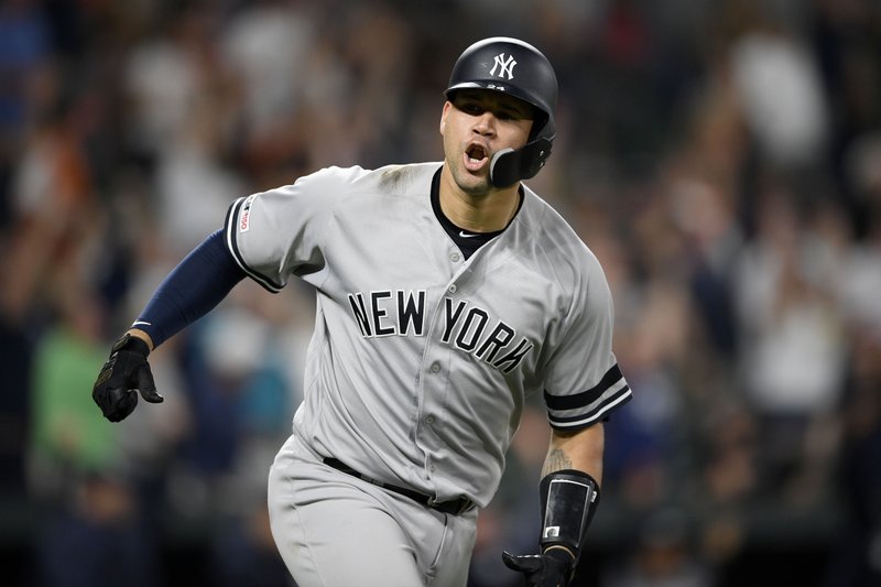 The Associated Press RALLY JOG: New York Yankees' Gary Sanchez reacts as he heads to first to round the bases after hitting a three-run home run Monday during the ninth inning against the Baltimore Orioles in Baltimore.