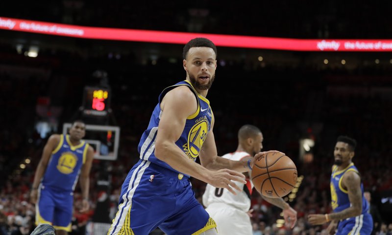 The Associated Press EXPERIENCE LEADS WAY: Golden State Warriors guard Stephen Curry (30) dribbles during the first half of Monday's NBA Western Conference final against the Portland Trail Blazers in Portland, Ore.