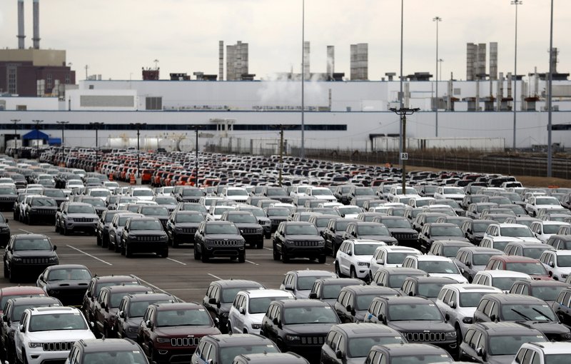 In this Feb. 26, 2019 file photo, Jeep vehicles are parked outside the Jefferson North Assembly Plant in Detroit. Fiat Chrysler can move forward with plans to build a new, $1.6 million assembly plant on Detroit's Eastside and invest $900 million to retool and modernize another.  (AP Photo/Carlos Osorio, File)