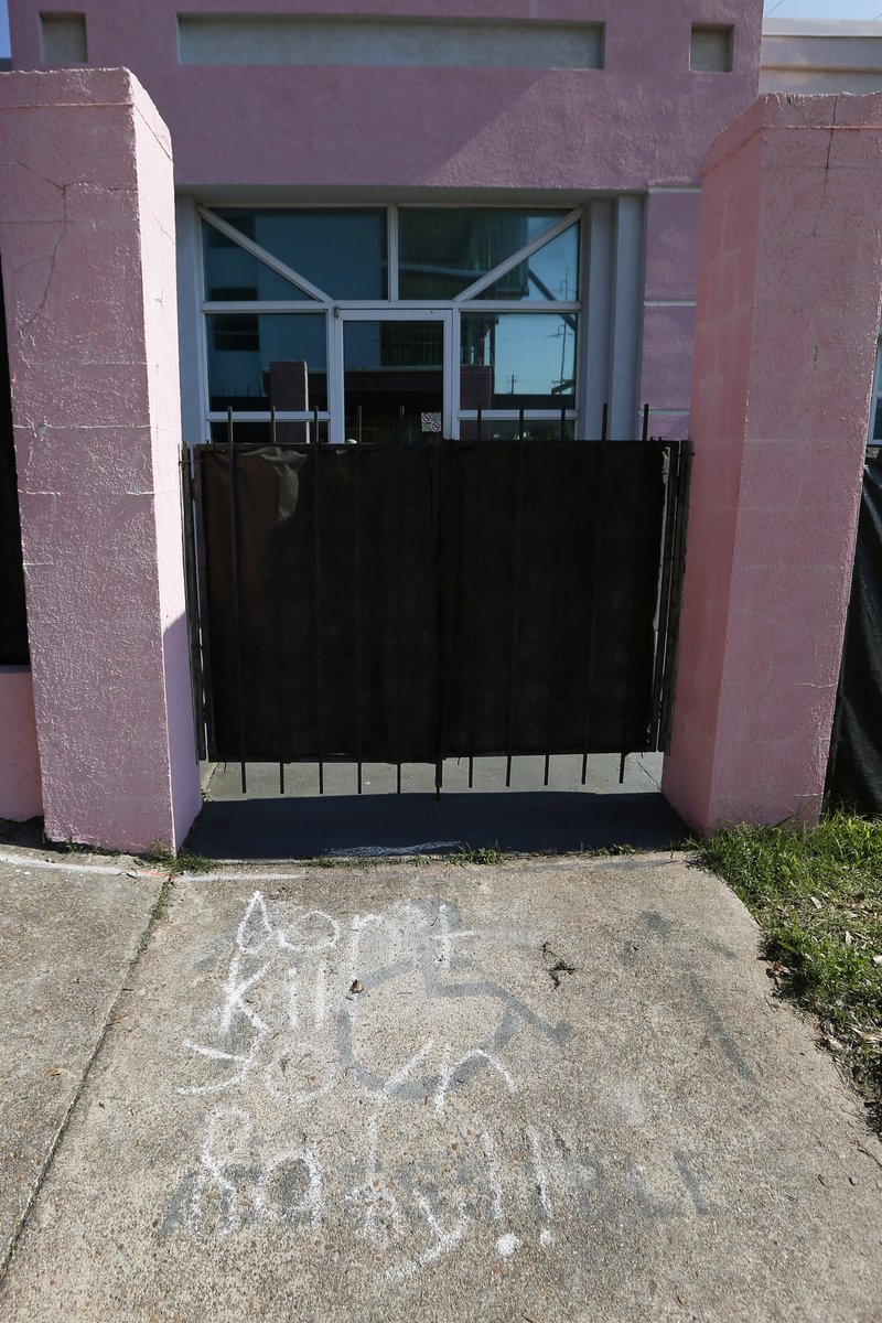 Anti-abortion messages written in chalk are drawn along the sidewalk leading to the Jackson Women's Health Organization, Friday, May 17, 2019, in Jackson, Miss. The facility is the state's only abortion clinic. (AP Photo/Rogelio V. Solis)