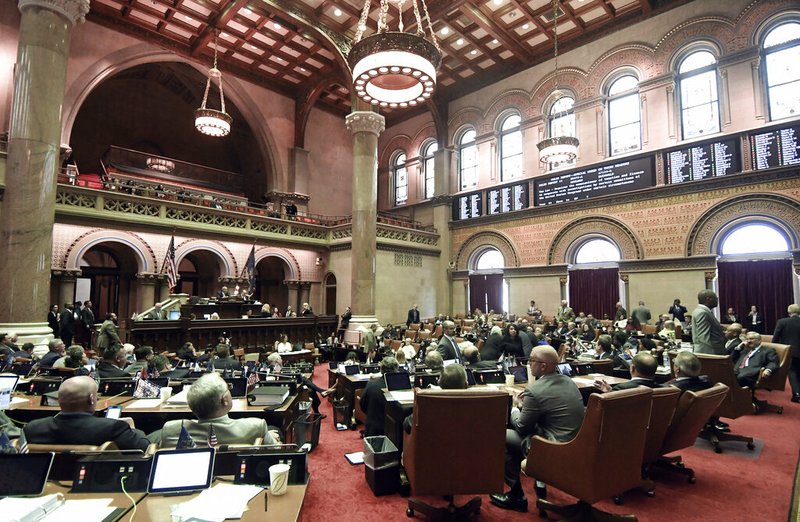 Members of the New York state Assembly vote on legislation that authorizes state tax officials to release, if requested, individual New York state tax returns to Congress, during a session in the Assembly Chamber at the state Capitol, Wednesday, May 22, 2019, in Albany, N.Y. (AP Photo/Hans Pennink)