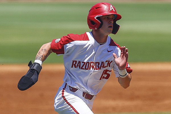 Arkansas' Casey Martin runs home to score on a RBI single from Arkansas' Dominic Fletcher during the first inning of a Southeastern Conference tournament game against Ole Miss, Wednesday, May 22, 2019, in Hoover, Ala. (AP Photo/Butch Dill)

