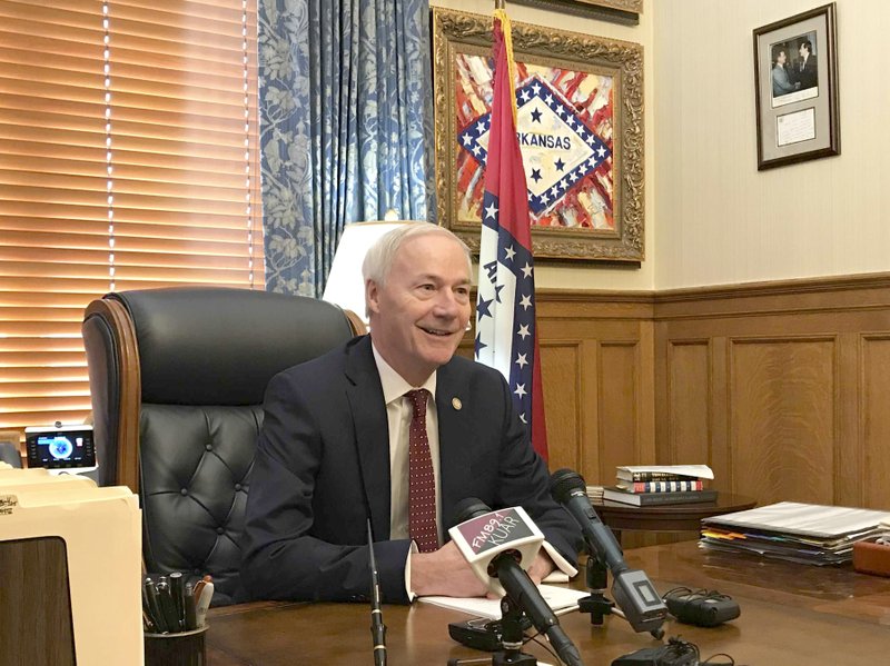 Arkansas Gov. Asa Hutchinson talks to reporters at the state Capitol in Little Rock, Wednesday about the 15 cabinet secretaries he's named under a government reorganization plan. Hutchinson said the new secretaries will begin work July under the reorganization plan that lawmakers approved earlier this year, calling the plan the largest government reorganization in Arkansas in nearly 50 years. (AP Photo/Andrew DeMillo)

