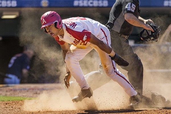 Arkansas pinch runner Curtis Washington reacts after scoring a run during an SEC Tournament game against Ole Miss on Wednesday, May 22, 2019, in Hoover, Ala.