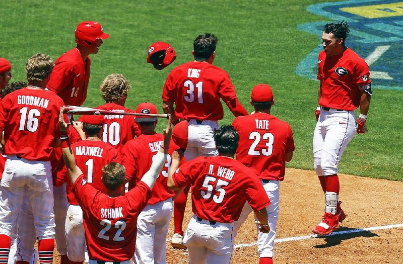 Georgia’s Cam Shepherd (right) celebrates with teammates after hitting a game-winning, two-run home run in the ninth inning against Texas A&M at the SEC Tournament on Wednesday. The Bulldogs face Arkansas today.