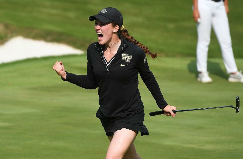 Wake Forest’s Emilia Migliaccio celebrates a birdie putt to win the 12th hole Wednesday. Migliaccio defeated Duke’s Gina Kim 1 up for one of the Demon Deacons’ two points in the championship match.