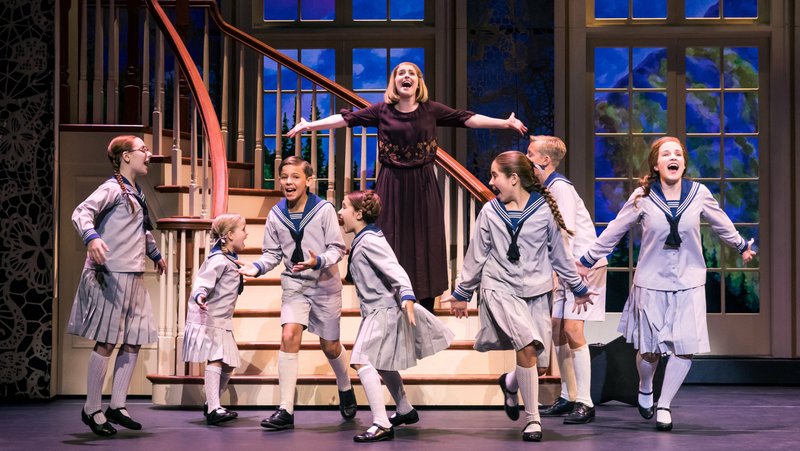 Jill-Christine Wiley as Maria romps with the von Trapp children in The Sound of Music.

