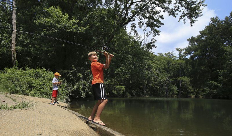 Pinnacle Mountain State Parks and other parks across Arkansas help families get ready for a summer of outdoor fun with their Memorial Day weekend programs. Democrat-Gazette file photos
