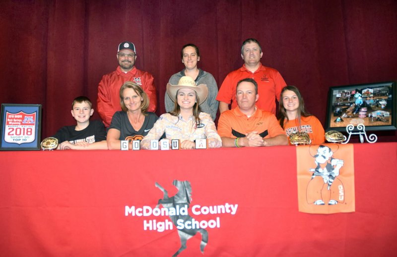 RICK PECK/SPECIAL TO MCDONALD COUNTY PRESS Callie Keaton recently signed to attend Oklahoma State University on a rodeo scholarship. Shown (front, left) is Rhett Keaton (brother), Jennifer Keaton (mom), Callie Keaton, Vance Keaton (dad) and Courtney Keaton (sister); (back, left) is MCHS FFA advisors Rob Hall, Emily Hutton and Shawn McAlister.