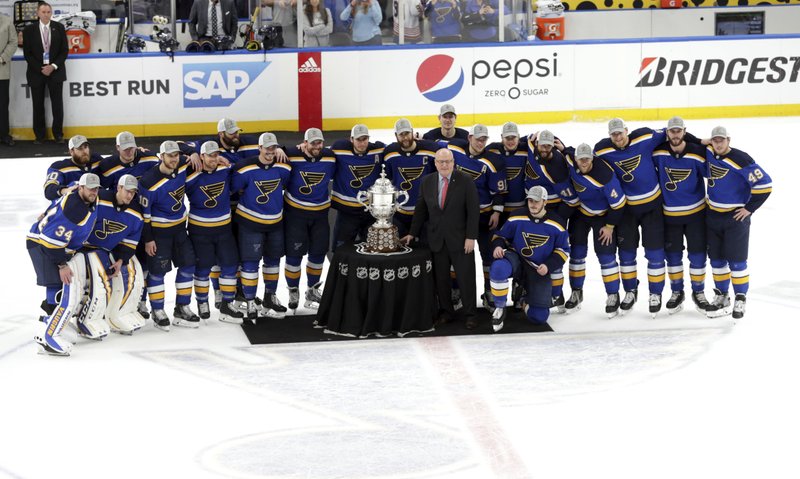 The Associated Press BLUES VS. BRUINS: Members of the St. Louis Blues are presented the Clarence S. Campbell Bowl by NHL deputy commissioner Bill Daly after defeating the San Jose Sharks Tuesday in the NHL Stanley Cup Western Conference final in St. Louis. The Bruins and Blues will meet in the Stanley Cup Final, a rematch of the 1970 series that ended with Bobby Orr's famous goal and leaping celebration. Boston has been in the final three times in the past nine seasons, but this is St. Louis' first trip in 49 years.