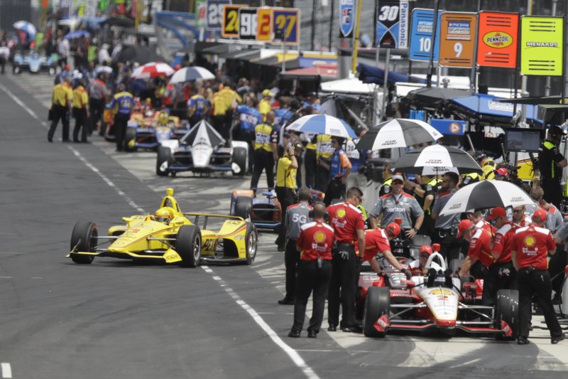 Helio Castroneves, of Brazil, pulls out of the pits during practice for the Indianapolis 500 IndyCar auto race at Indianapolis Motor Speedway, Friday, May 17, 2019 in Indianapolis. (AP Photo/Darron Cummings)