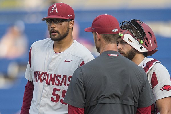 Arkansas pitcher Isaiah Campbell (55), catcher Casey Opitz and pitching coach Matt Hobbs talk during an SEC Tournament game against Georgia on Thursday, May 23, 2019, in Hoover, Ala. 