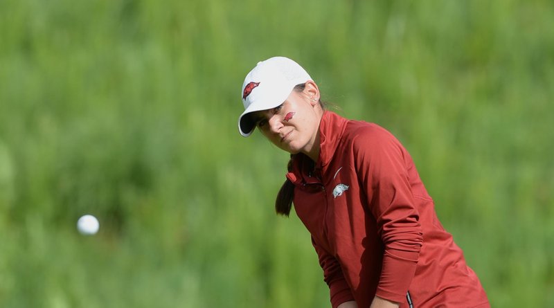 Kaylee Benton of Arkansas chips onto the 13th green Tuesday, May 21, 2019, during her match with Jennifer Kupcho of Wake Forest in the Women's NCAA Golf Championship at Blessings Golf Club in Johnson. 