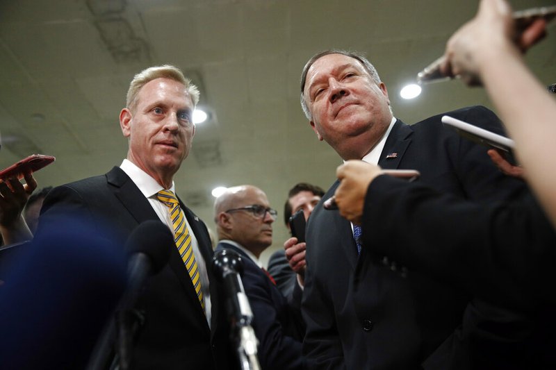 Acting Defense Secretary Patrick Shanahan, left, and Secretary of State Mike Pompeo speak to members of the media after a classified briefing for members of Congress on Iran, Tuesday, May 21, 2019, on Capitol Hill in Washington. (AP Photo/Patrick Semansky)