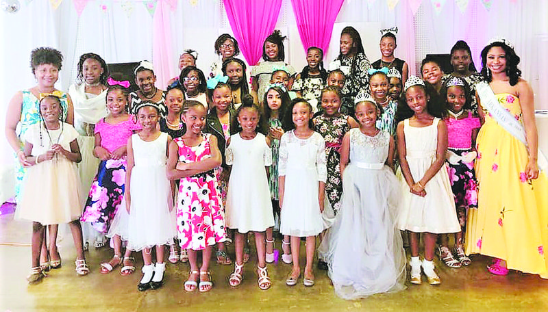 Area girls attend Mayor Veronica Smith-Creer's "Royal Tea." The tea was held May 18 and was the first in what the mayor is hoping will be a series of events to inspire youth and give back to the community. Smith-Creer, left, front row, said the next tea for older girls is set for June 15.