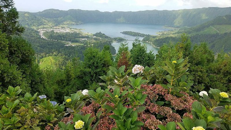 Sete Cidades, a 3-mile-wide volcanic crater filled with lakes and a village, is the most photographed site in the Azores, as seen from Vista do Rei on Sao Miguel Island.