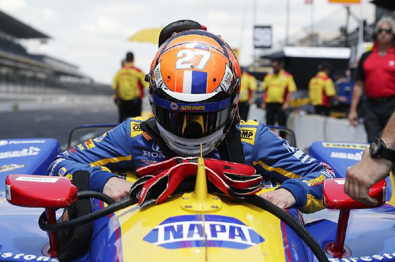 Alexander Rossi lowers himself into his car last week at the Indianapolis Motor Speedway. Rossi, the 2016 Indy 500 winner who will start ninth in Sunday’s 500, previously raced in Formula One.