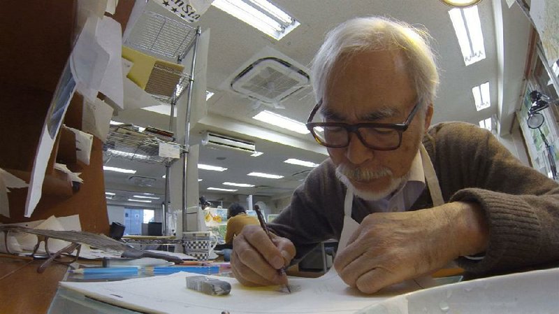 The venerable Hayao Miyazaki works at his drawing table in this scene from the 2018 lm Never Ending Man: Hayao Miyazaki. 