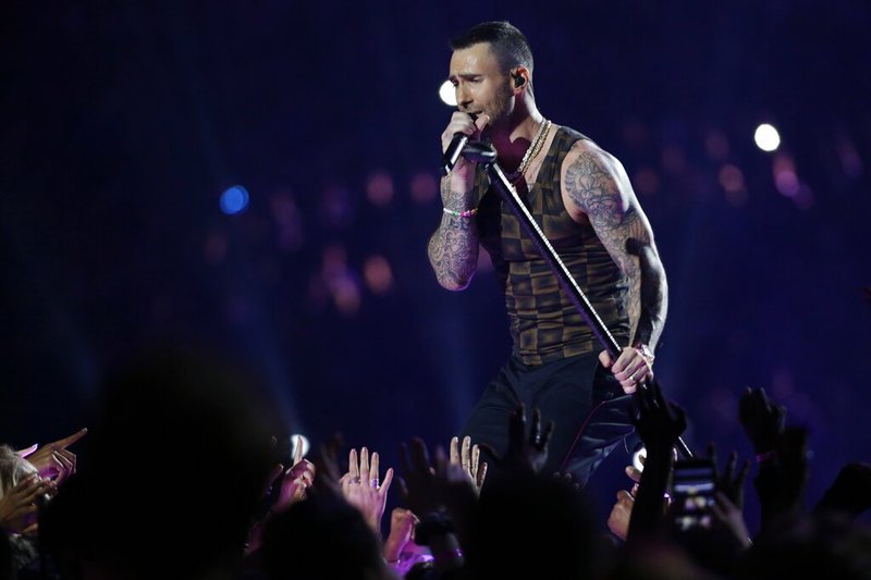 In this Feb. 3, 2019 file photo, Adam Levine, of Maroon 5, performs during halftime of the NFL Super Bowl 53 football game between the Los Angeles Rams and the New England Patriots in Atlanta. Levine is leaving NBC's "The Voice" after 16 seasons. Carson Daly made the announcement Friday morning, May 24 on the "Today" show. Daly said Gwen Stefani will return for season 17 in Levine's chair. (AP Photo/Mark Humphrey, File)