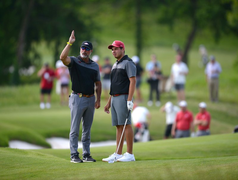 Arkansas men's golf coach Brad McMakin (left) and Julian Perico speak Friday, May 24, 2019, on the fifth fairway during the first day of play in the Men's NCAA Golf Championships at Blessings Golf Club in Johnson. Visit nwadg.com/photos to see more photographs from the day's rounds.