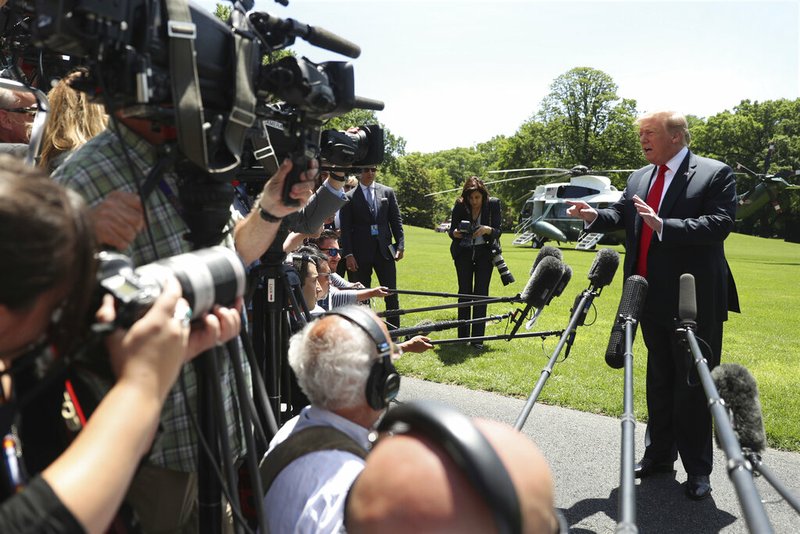 President Donald Trump speaks to members of the media on the South Lawn of the White House in Washington, Friday, May 24, 2019, before boarding Marine One for a short trip to Andrews Air Force Base, Md., and then on to Tokyo(AP Photo/Andrew Harnik)