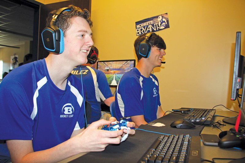 Bryant juniors Adam Perry, left, and Baker Bright practice their skills in the video game Rocket League. The Bryant eSports team recently won Arkansas’ first eSports high school state championship by defeating Greenwood on May 11. 