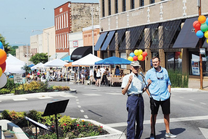 Robert Carius, left, former chairman of Main Street Batesville, and Batesville Mayor Rick Elumbaugh welcome visitors to the 2018 Southern Food Festival, sponsored by Main Street Batesville. This year’s festivities will take place Saturday, starting at 8 a.m.