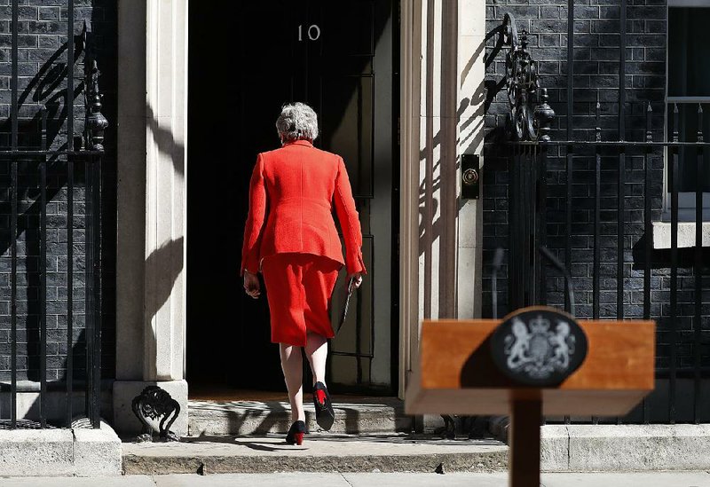 British Prime Minister Theresa May walks away from the lectern Friday after announcing her resignation. She said it had been “the honor of my life” to serve as the second woman prime minister, after Margaret Thatcher. But “certainly not the last,” she said. 