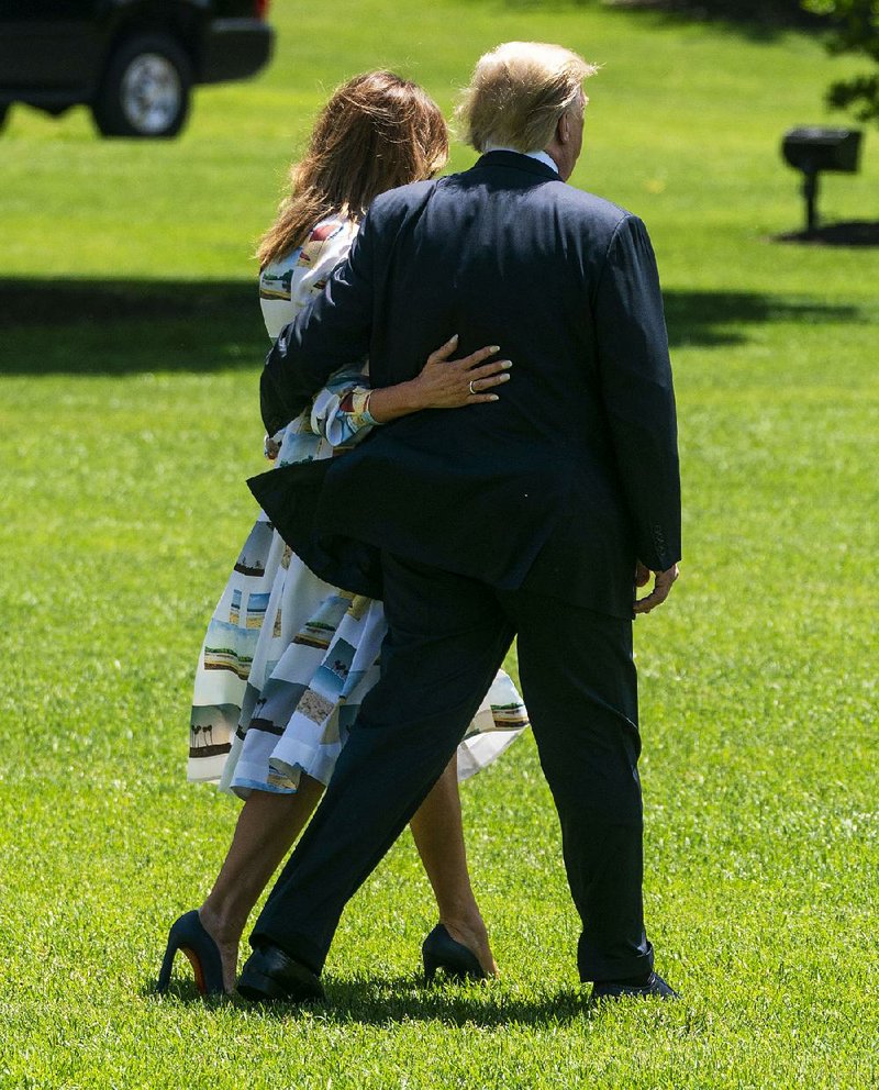 President Trump and his wife, Melania, depart the White House on Friday for a trip to Japan. Before he left, Trump downplayed the troop deployment to the Middle East, calling it “a relatively small number of troops — mostly protective.” 