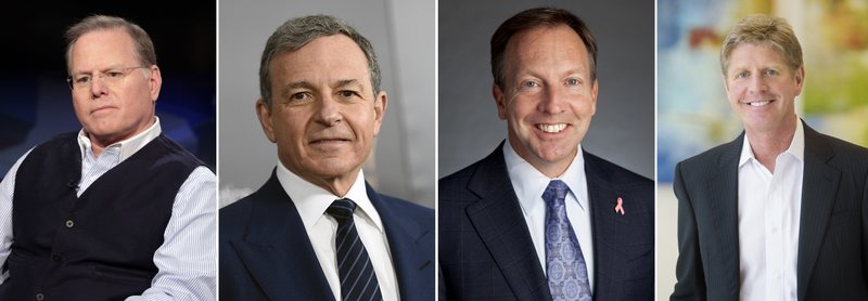 This photo combination shows four of the highest-paid CEOs at big U.S. companies for 2018, as calculated by The Associated Press and Equilar, an executive data firm. From left: David Zaslav, Discovery, $129.5 million; Robert Iger, Walt Disney, $65.6 million; Stephen MacMillan, Hologic, $42 million; and Joseph Hogan, Align Technology, $41.8 million. The third-highest paid CEO, Richard Handler of Jefferies Financial Group, is not pictured. Handler made $44.7 million. (AP Photo)