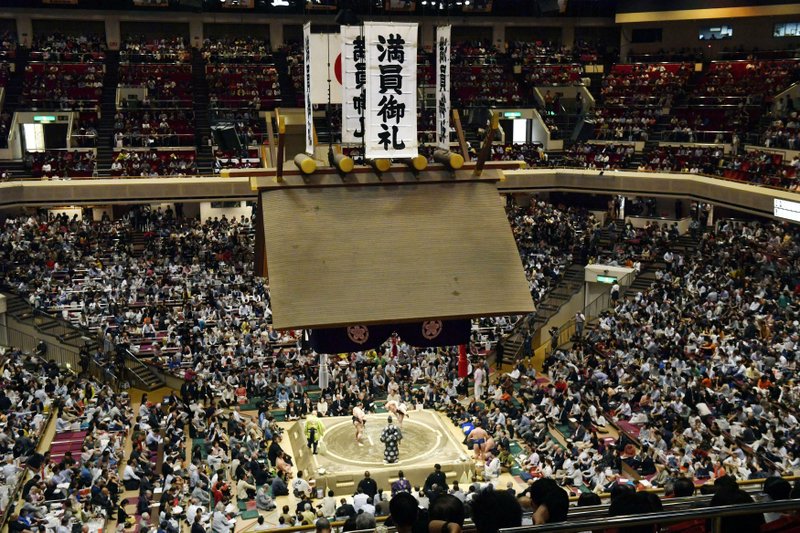 In this May 12, 2019, file photo, banners thanking for a sellout crowd are displayed on the first day of Summer Grand Sumo Tournament in Tokyo. U.S. President Donald Trump's Japan visit starting on Saturday, May 25, 2019, is to focus on personal ties with Japanese Prime Minister Shinzo Abe rather than substantive results on trade, security or North Korea. Then the two leaders and their wives will watch sumo together in the evening before a restaurant dinner. (Yoshitaka Sugawara/Kyodo News via AP, File)