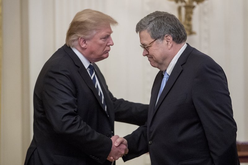 President Donald Trump and Attorney General William Barr shake hands during a Public Safety Officer Medal of Valor presentation ceremony in the East Room of the White House in Washington, Wednesday, May 22, 2019.(AP Photo/Andrew Harnik)