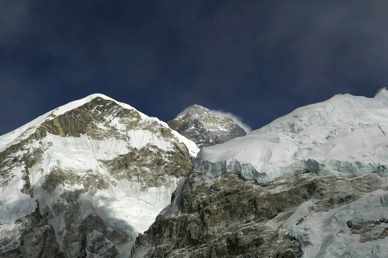 In this March 7, 2016, file photo, Mt. Everest, in middle, altitude 8,848 meters (29,028 feet), is seen on the way to base camp. American climber Don Cash who fulfilled his dream of climbing the highest mountains on each of the seven continents by reaching the summit of Mount Everest died of probable altitude sickness on the way down, mountaineering officials said Friday, May 24, 2019. Cash became ill at the summit and was treated there by his two Sherpa guides, one of the officials said. (AP Photo/Tashi Sherpa, File)