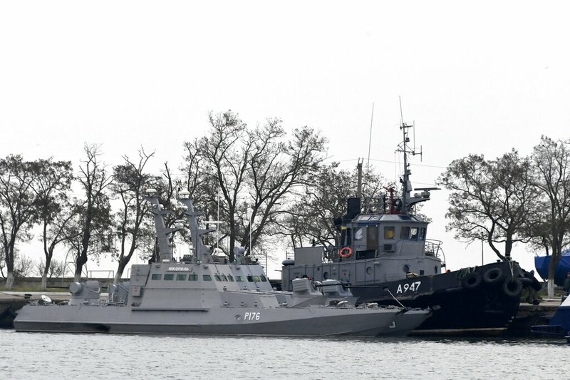 In this Monday, Nov. 26, 2018 file photo, three Ukrainian ships are docked near the Kerch after been seized on Sunday, in Kerch, Crimea. A U.N. maritime tribunal has ruled that Russia must release three Ukrainian naval vessels captured by Russia in November and release 24 detained sailors. The Hamburg-based International Tribunal for the Law of the Sea delivered its verdict Saturday, May 25, 2019 on the case Ukraine brought against Russia. (AP Photo, File)