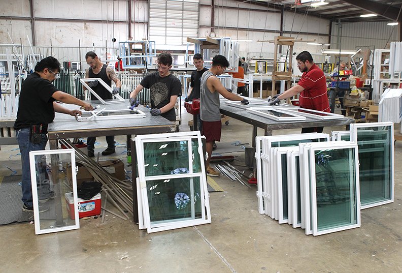 The Sentinel-Record/Richard Rasmussen ASSEMBLY: Window Mart employees assemble windows at the 1560 Albert Pike Road plant.