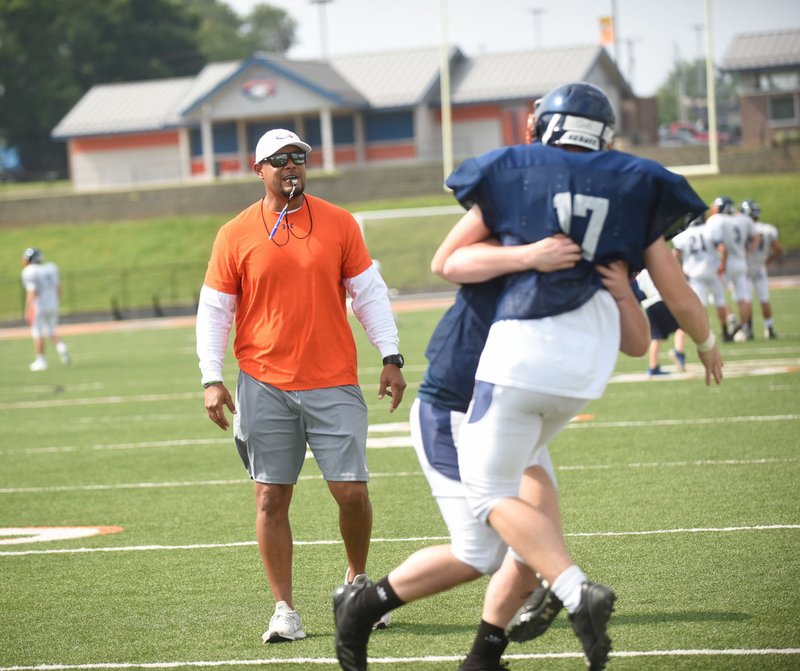 NWA Democrat-Gazette/FLIP PUTTHOFF Rogers Heritage football coach Steve Hookfin watches during a drill during the War Eagles' final day of spring practice earlier this week. Hookfin was hired a little over a month ago to replace Tony Travis, who took a job in administration at Prairie Grove.
